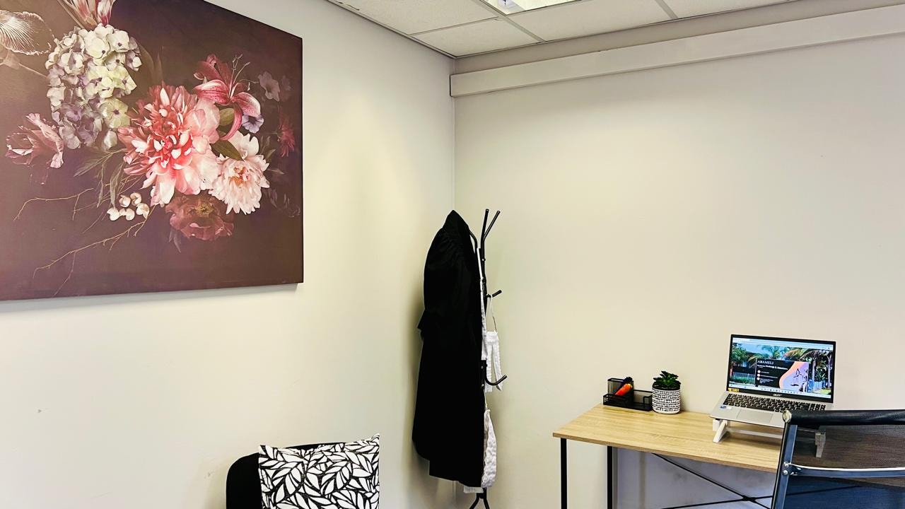 Nondumiso Nkabinde & Associates office — consultation room with desk and artwork